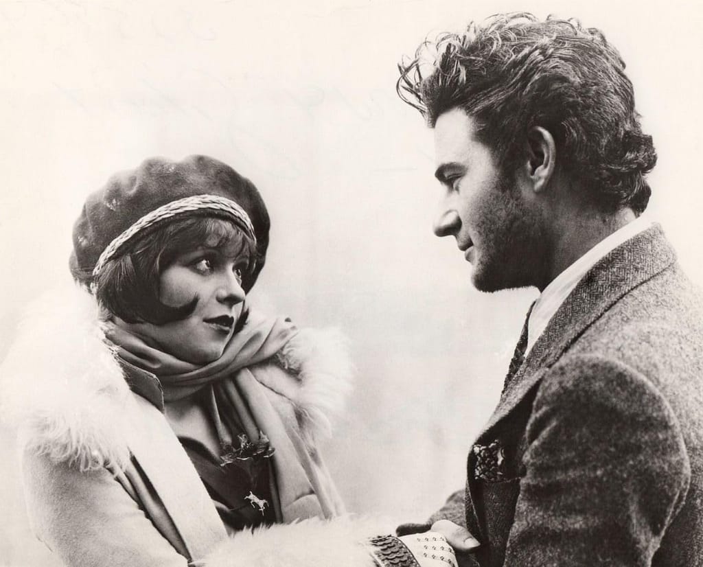 Clara Bow (left) with Gilbert Roland (right)