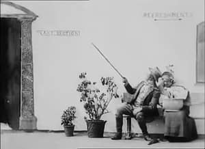 A man and woman sit on a bench in Robert W. Paul's 1898 film Come Along, Do!