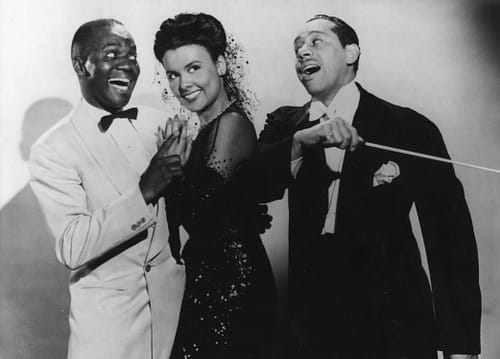 Classic African American performers Bill Robinson, Lena Horne, and Cab Calloway in a publicity still for Stormy Weather.