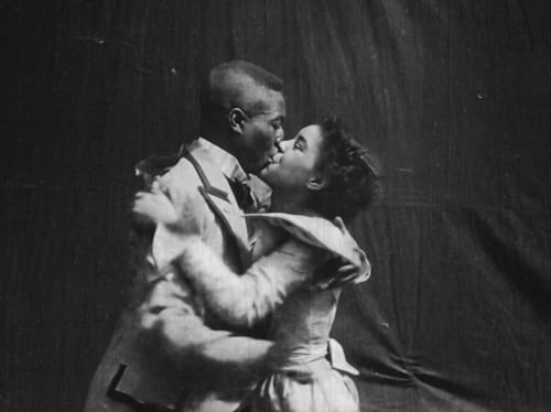 Two unidentified African American actors kiss in Something Good—Negro Kiss.